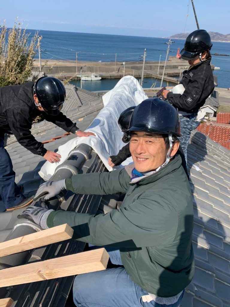 japanese roofer on top of the roof